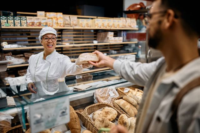happy-supermarket-baker-serving-male-customer-2024-12-13-21-54-06-utc (1) (1)